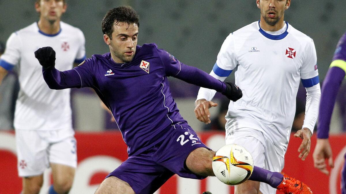 Fiorentina's Giuseppe Rossi, left, kicks the ball during a Europa League match against Belenenses in Florence, Italy in Dec. 2015.