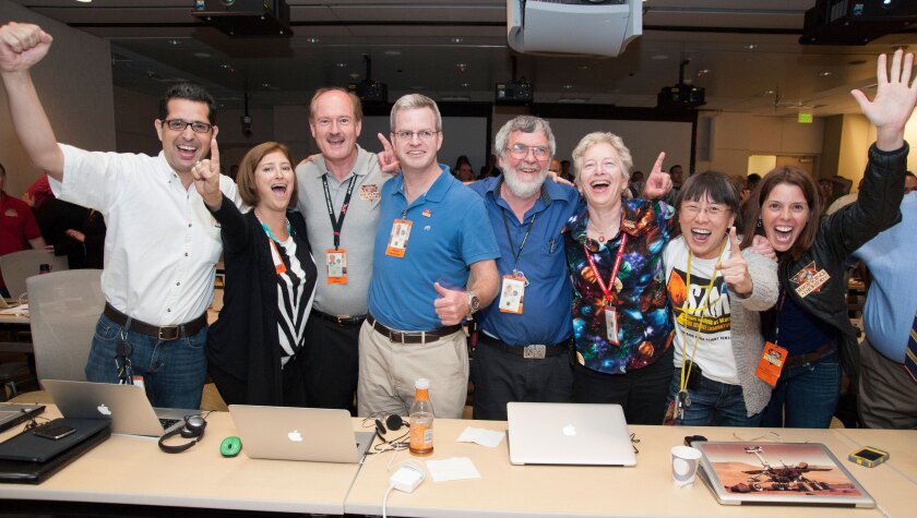 Laurie Leshin, second from left, celebrates the landing of the Curiosity rover with members of the science teams at JPL. 