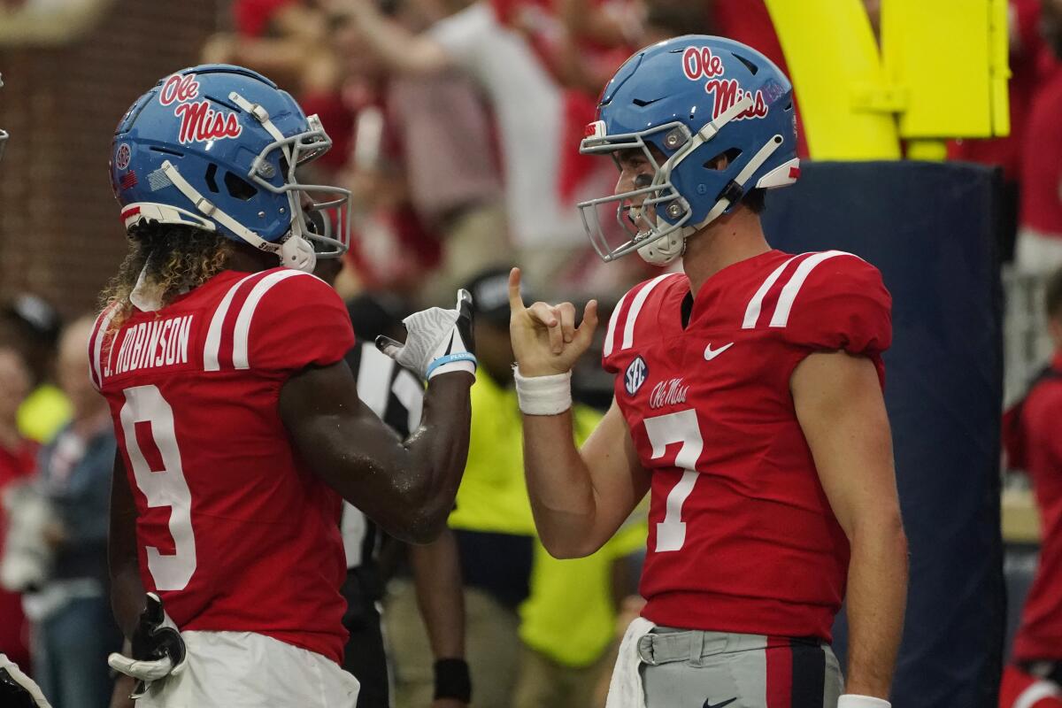 Mississippi quarterback Luke Altmyer (7) celebrates his one-yard rushing touchdown with Mississippi wide receiver Jaylon Robinson (9) during the first half of an NCAA college football game in Oxford, Miss., Saturday, Sept. 10, 2022. (AP Photo/Rogelio V. Solis)