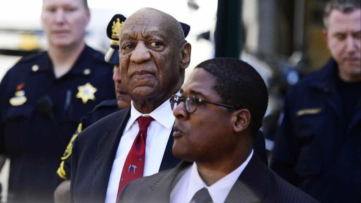 Bill Cosby looks around before he leaves the Montgomery County Courthouse on Thursday in Norristown, Pa.