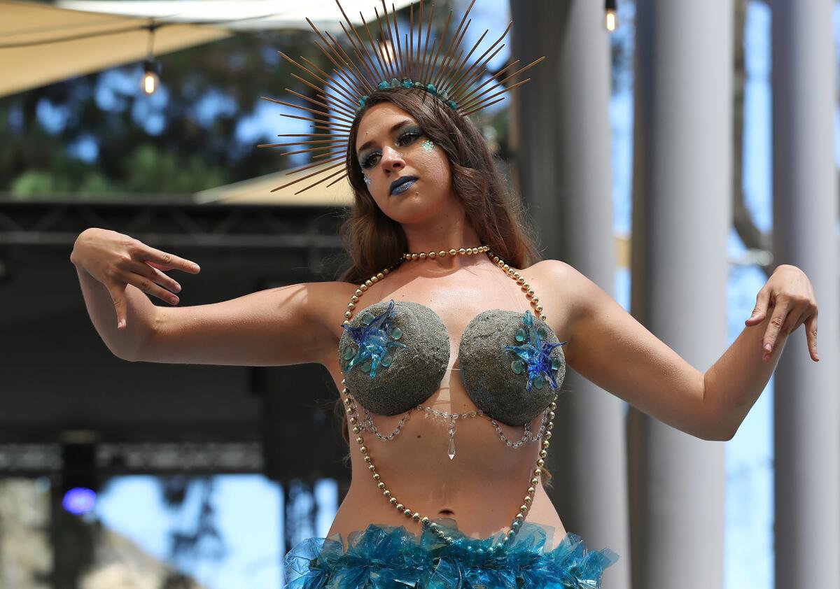 The dress of artist Cody Nicely, modeled by McKenna Michels, during the Festival of Arts runway fashion show.