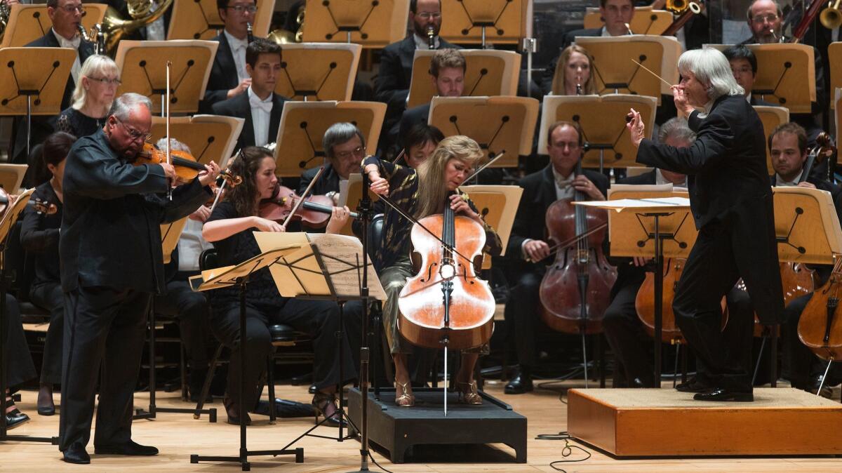 Pacific Symphony conductor Carl St. Clair leads husband-and-wife soloists Jaime Laredo (on violin) and Sharon Robinson (cello) in the Brahms Double Concerto in a May 2015 performance.