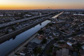 CARSON, CA - November 21 2021: The Dominguez Channel runs though neighborhoods on Sunday, Nov. 21, 2021 in Carson, CA. (Brian van der Brug / Los Angeles Times