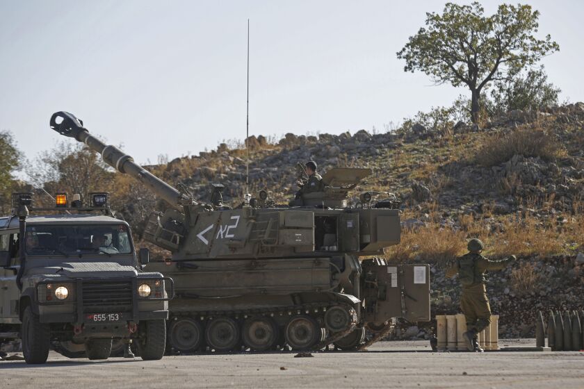 An Israeli M109 self-propelled howitzer is stationed near the border with Syria in the Israeli-controlled Golan Heights on Nov. 19.