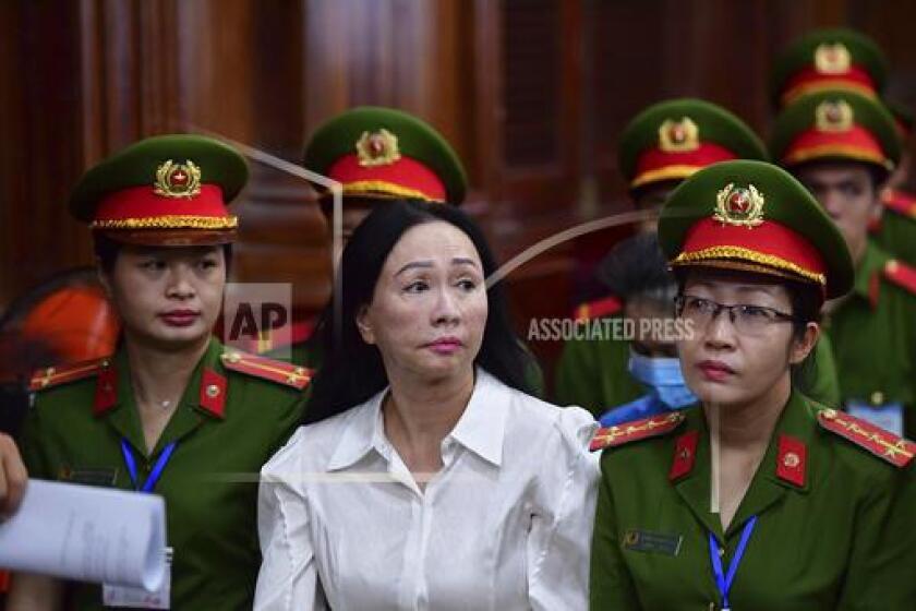 Business woman Truong My Lan, front center, attends a trial in Ho Chi Minh City, Vietnam on Thursday, April 11, 2024. The real estate tycoon may face the death penalty if convicted of allegations that she siphoned off an amount of $12.5 billion, nearly 3 percent of Vietnam's 2022 GDP, in its largest financial fraud case. (Thanh Tung/VnExpress via AP)