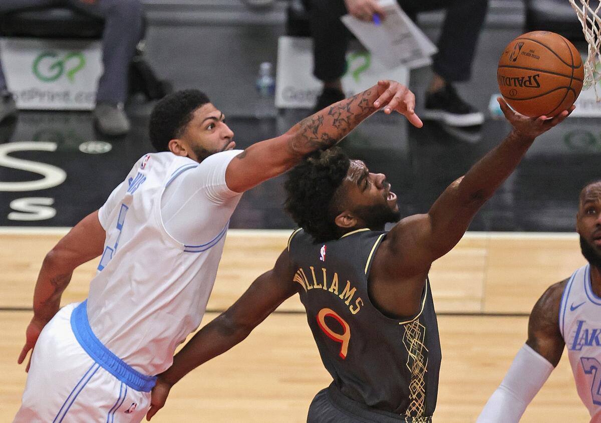 Lakers forward Anthony Davis challenges a shot by Bulls forward Patrick Williams on Jan. 23, 2021, in Chicago.