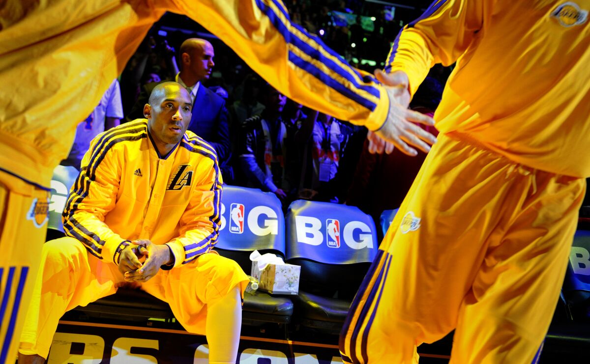 Kobe Bryant waits to be introduced before a game against the Oklahoma City Thunder at Staples Center in 2013.