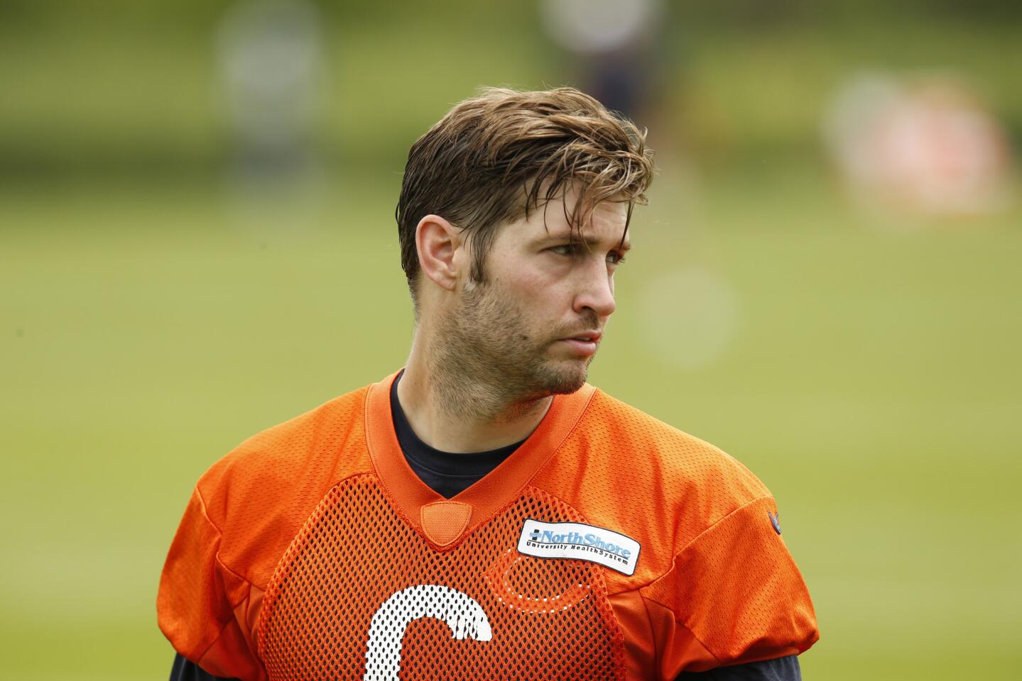 Bears quarterback Jay Cutler walks off the field at the end of minicamp at Halas Hall on June 17.