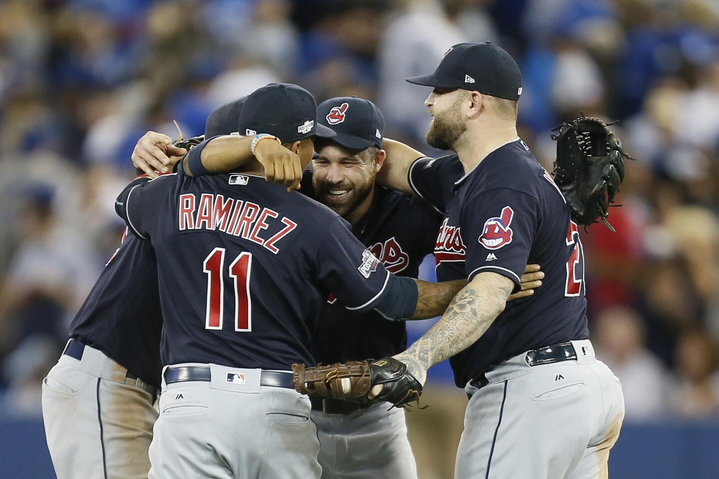 Oct 17, 2016; Toronto, Ontario, CAN; Cleveland Indians third baseman Jose Ramirez (11), second baseman Jason Kipnis (center), and first baseman Mike Napoli (right) celebrate after game three of the 2016 ALCS playoff baseball series against the Toronto Blue Jays at Rogers Centre. Mandatory Credit: John E. Sokolowski-USA TODAY Sports ** Usable by SD ONLY **
