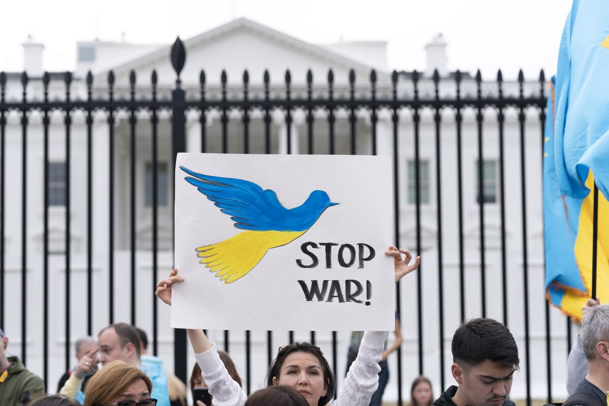 People protest the Russian invasion of Ukraine during a rally outside of the White House March 6, 2022.  