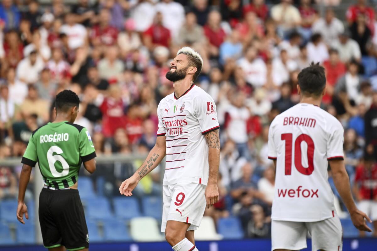 Milan's Olivier Giroud reacts during the Serie A soccer match between Sassuolo and Milan at Mapei Stadium, Reggio Emilia, Italy, Tuesday Aug. 30, 2022. (Massimo Paolone/LaPresse via AP)