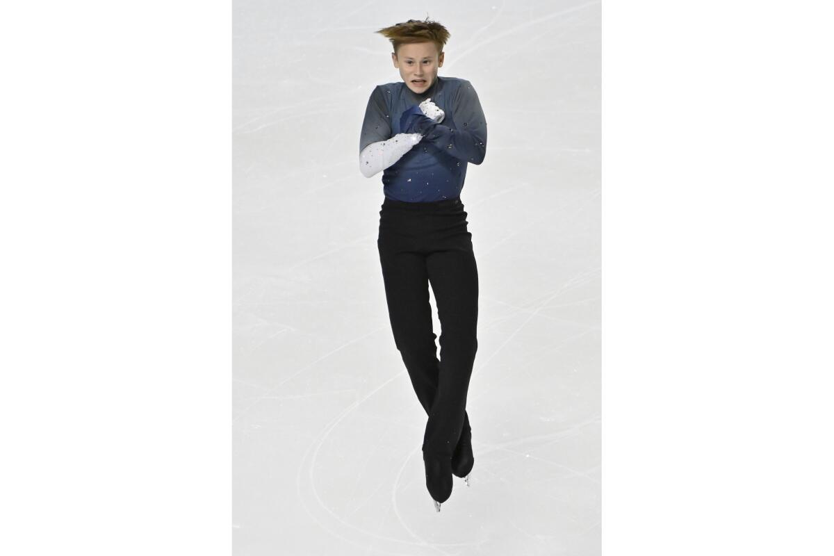 FILE - Ilia Malinin, of the United States, competes during the men's free skating program at the International Skating Union Grand Prix of Figure Skating Series, Saturday, Oct. 24, 2020, in Las Vegas. Ilia Malinin made history late Wednesday, Sept. 14, 2022, when the 17-year-old wunderkind, and the heir apparent to Olympic champion Nathan Chen among American figure skaters, successfully landed the first quad axel in competition. Malinin pulled off the four-and-a-half revolution jump while winning the lower-level U.S. Classic in Lake Placid, New York, before a small crowd in a mostly empty arena. (AP Photo/David Becker, File)