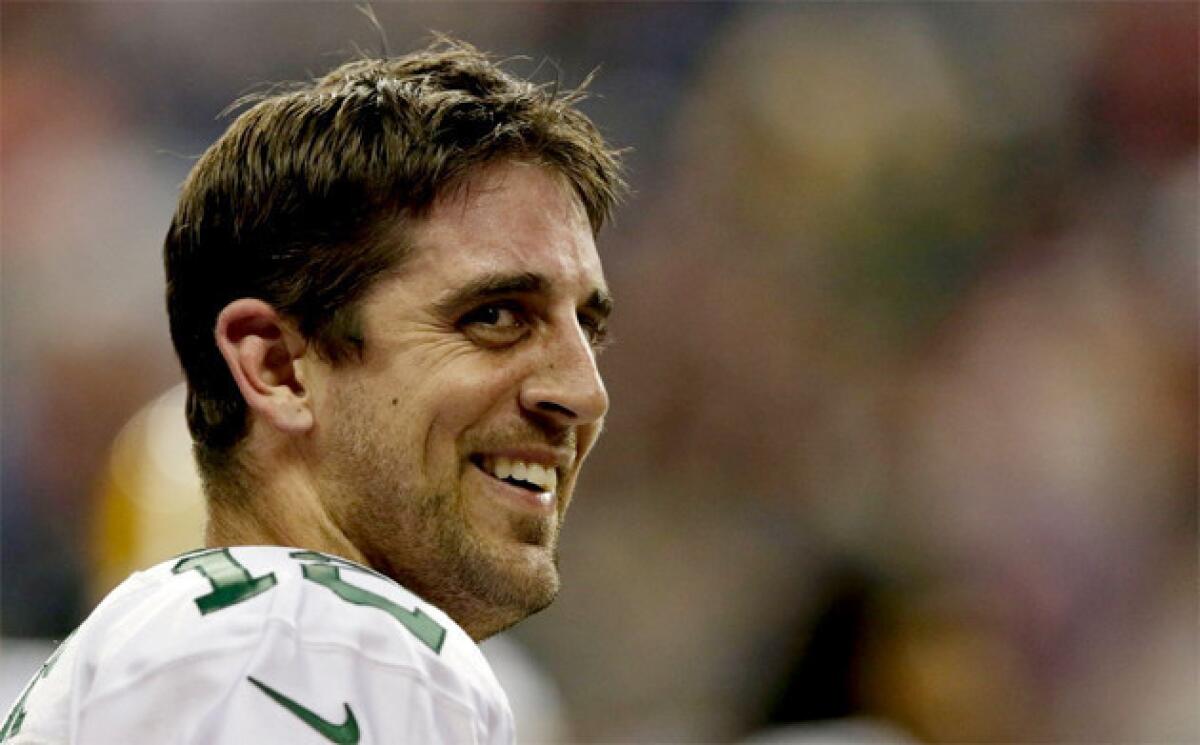 The Green Bay Packers signed quarterback Aaron Rodgers to a five-year contract extension through the 2019 season.