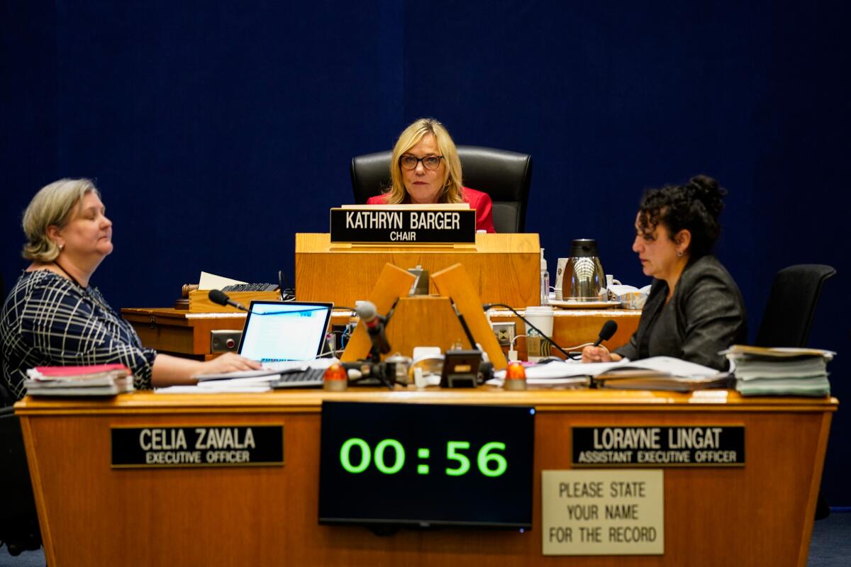 Seated center, Supervisor Kathryn Barger listens to testimony during a Board of Supervisors meeting where Los Angeles County elections chief Dean Logan testified Tuesday.