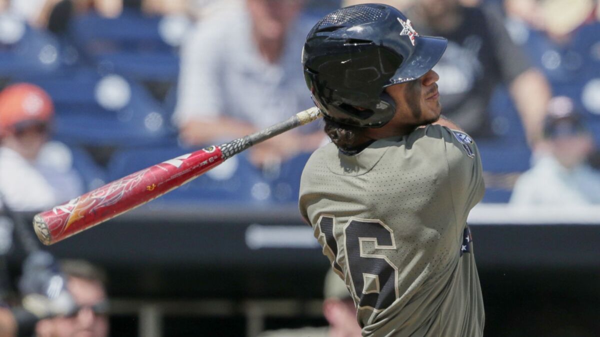 Vanderbilt's Austin Martin follows through on his two-run home run against Louisville in the seventh inning Sunday.