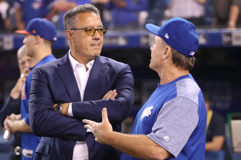 TORONTO, ON - JULY 4: Manager John Gibbons #5 (R) of the Toronto Blue Jays talks to former teammate and current television commentator Ron Darling before the start of MLB game action against the New York Mets at Rogers Centre on July 4, 2018 in Toronto, Canada. (Photo by Tom Szczerbowski/Getty Images)