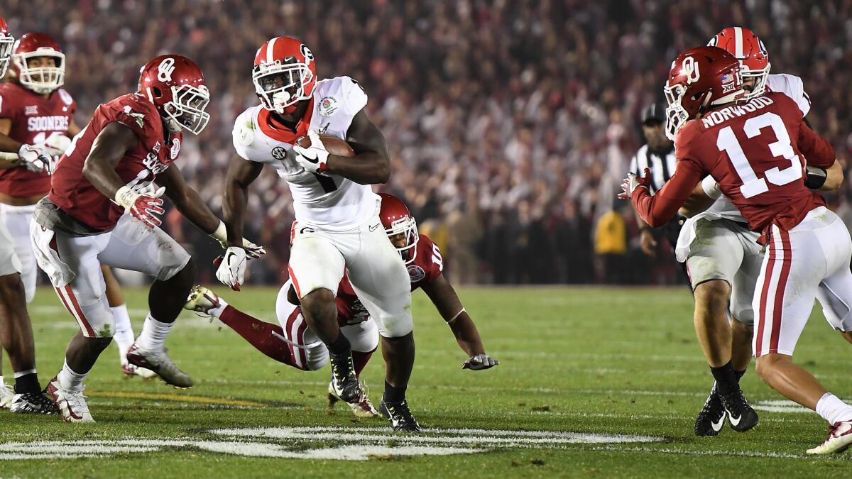 Georgia running back Sony Michel beaks past the line of scimmage during the game-winning touchdown run against Oklahoma in double overtime.