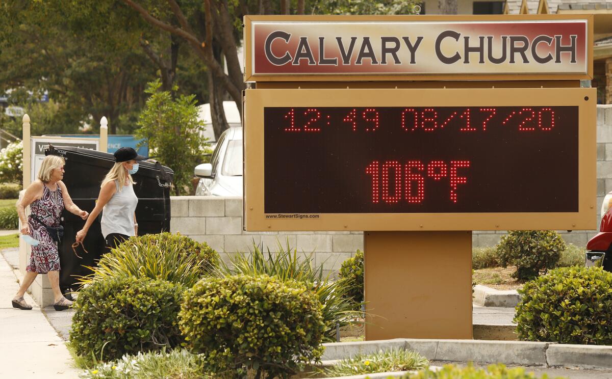 A sign shows a temperature of 106 in Woodland Hills at midday Monday.