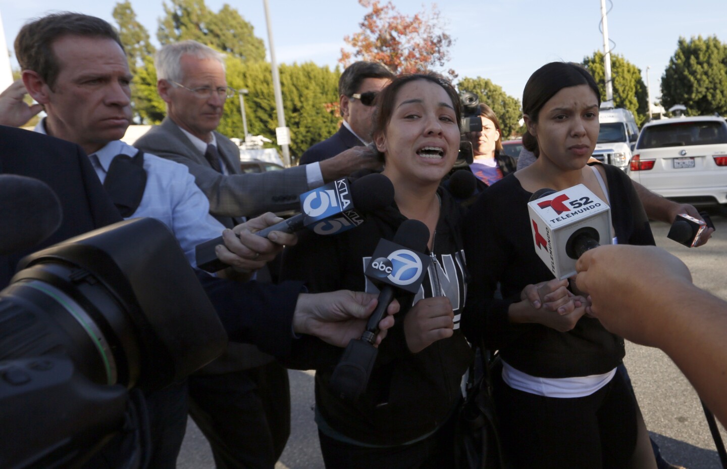Maricela Alvarado, sister of suspect Abel Diaz, cries as she walks to her car, insisting the teenager was not responsible for the death ofOfficer Ricardo Galvez. "My brother is innocent. He is not the shooter," said Alvarado, 24.