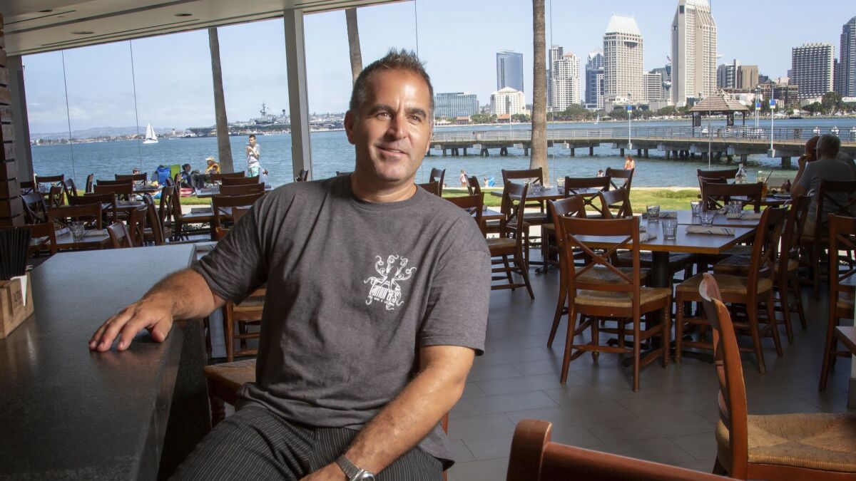 David Spatafore seated in the bar of the old Candelas on the Bay restaurant in Coronado. The restaurant opens Wednesday with a new name, el Roy's, and new management.