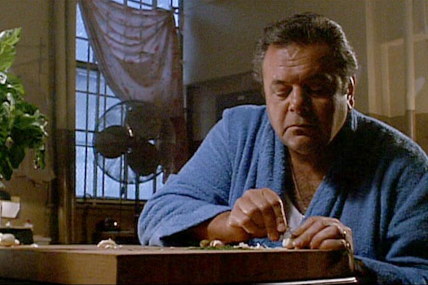 Screen grab from the movie "Goodfellas." Here Paul Sorvino cuts garlic with a razor blade. Courtesy of Warner Bros.