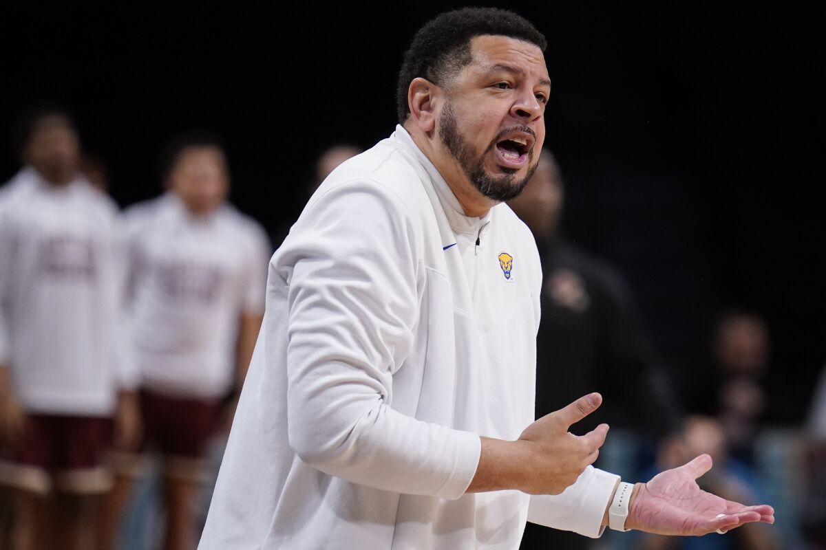 Pittsburgh head coach Jeff Capel works the bench during the first half of an NCAA college basketball game against Boston College of the Atlantic Coast Conference men's tournament, Tuesday, March 8, 2022, in New York. (AP Photo/John Minchillo)