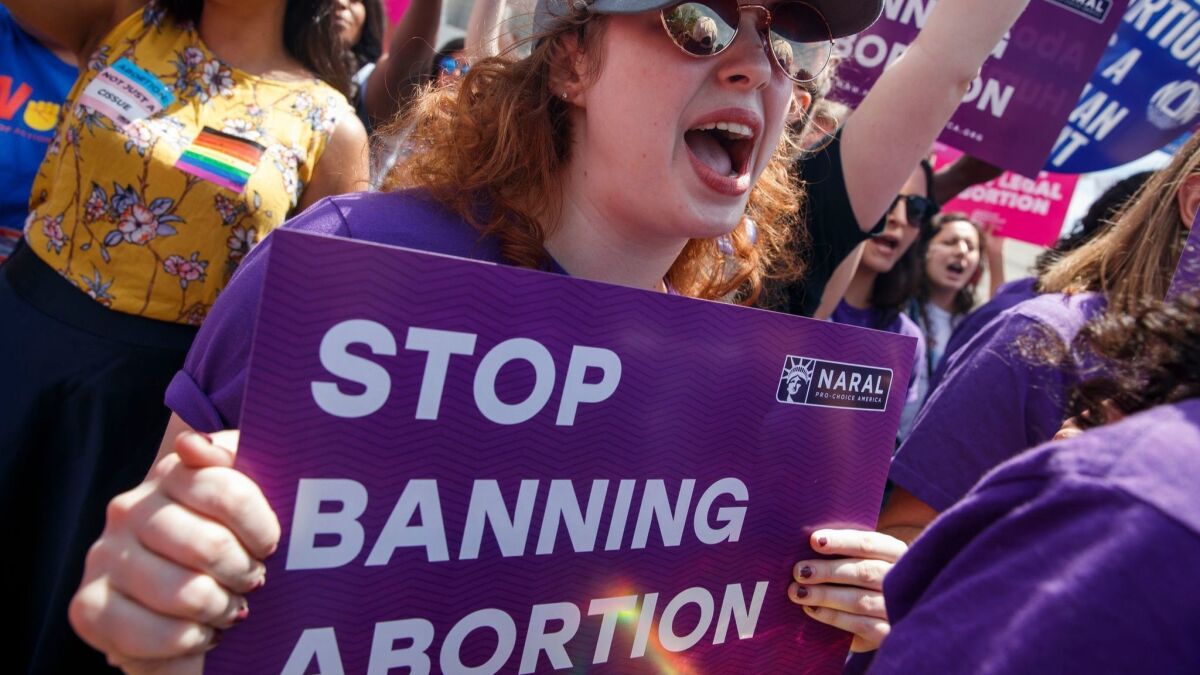 Abortion rights advocates protest at the U.S. Supreme Court on Friday.