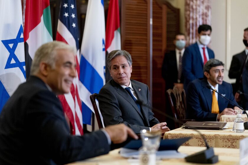 Secretary of State Blinken sits with Foreign Ministers Yair Lapid of Israel and Sheikh Abdullah bin Zayed al Nahyan of UAE.