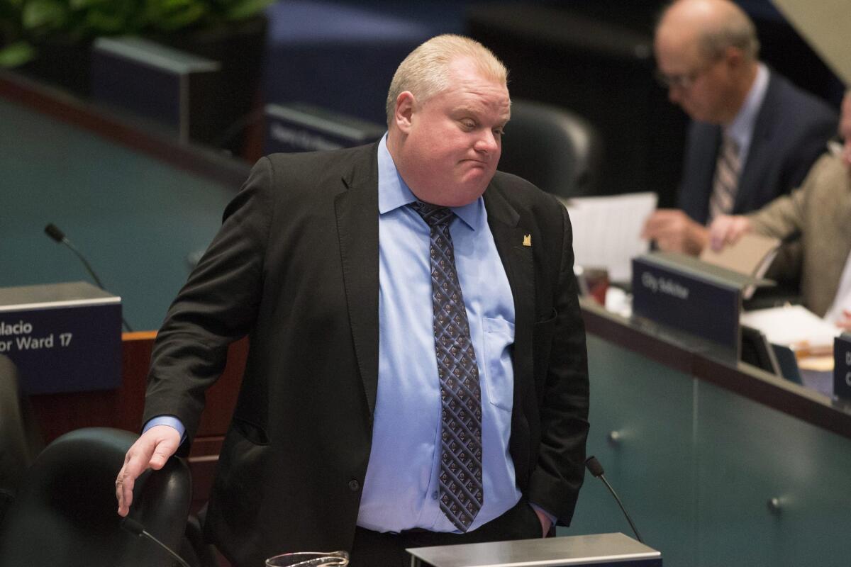 Toronto Mayor Rob Ford at Friday's City Council meeting, where council members voted 39-3 to strip him of his powers to appoint and remove committee chairs. Further moves to limit his authority in the wake of a substance-abuse scandal and erratic behavior are expected on Monday.