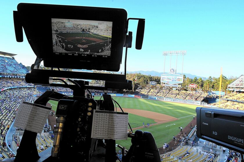 A TV camera is trained on the field at Dodger Stadium for the game between the Dodgers and Angels. Most fans in the region have been unable to tune into Dodgers games this season because they don't get service from Time Warner Cable.