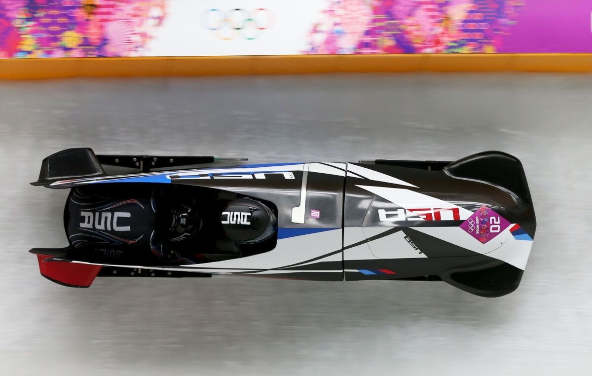 Pilot Elana Meyers and brakeman Lauryn Williams fly down the bobsled course at the Sanki Sliding Center en route to a silver medal finish Wednesday.