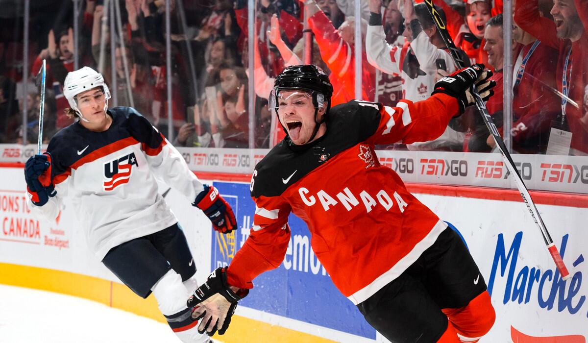 Canada's Max Domi reacts after scoring an empty-net goal to help Canada secure a 5-3 win in pool play over the U.S. at the junior world championships on Wednesday.