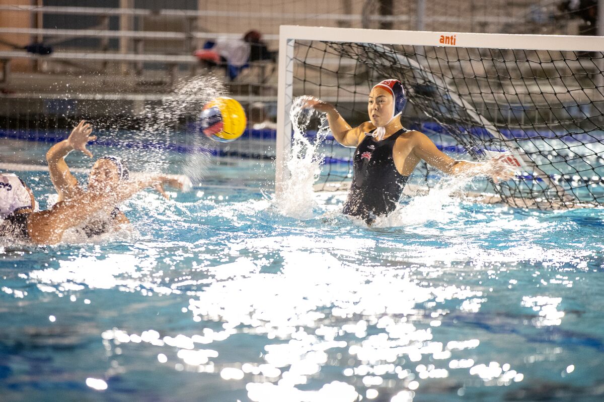CdM senior goalkeeper Sarah Decker rises for a save during Wednesday's match.