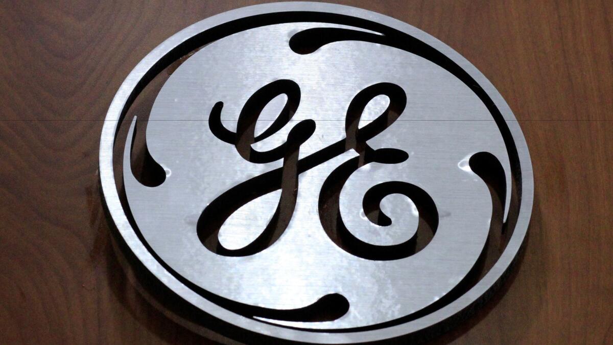A General Electric logo is displayed at a store in Cranberry Township, Pa., in 2014.