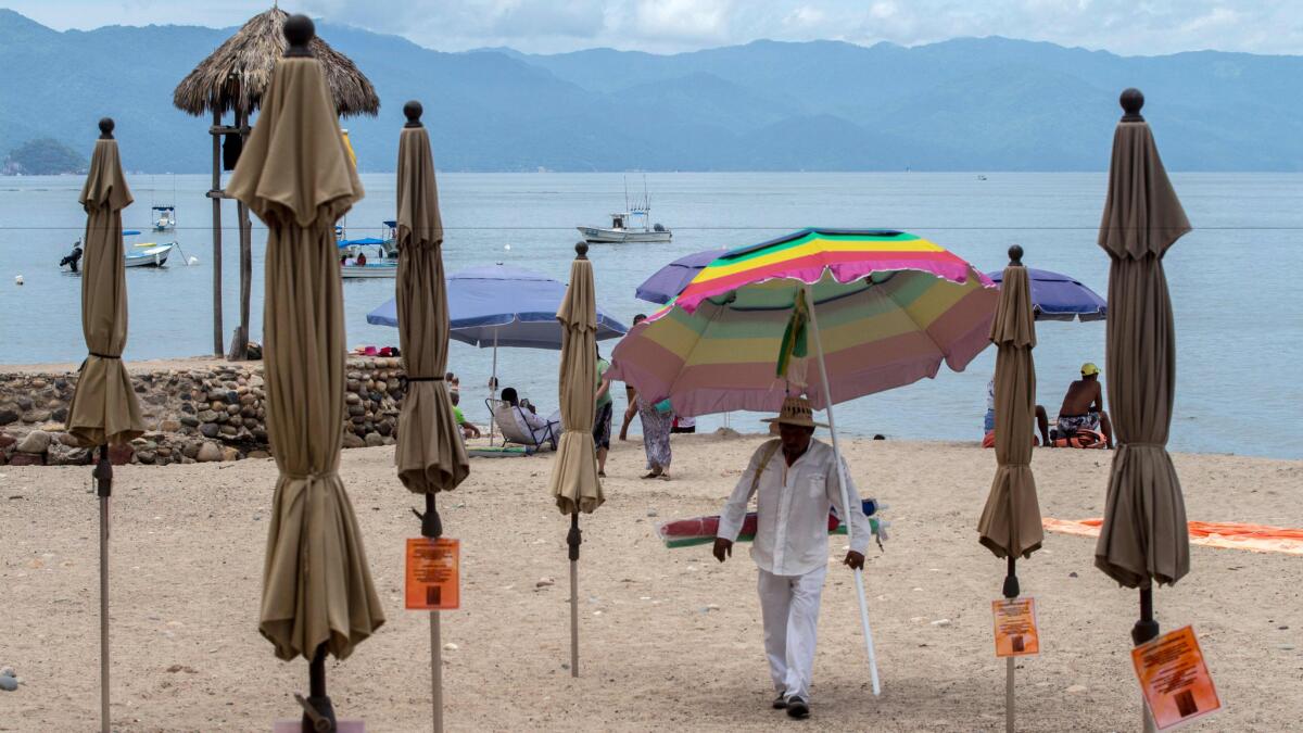 People enjoy the beach in the resort city of Puerto Vallarta, Mexico.