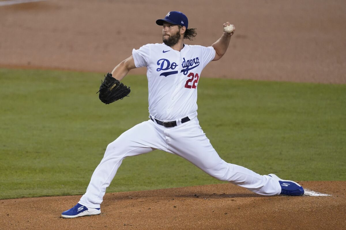 Dodgers starter Clayton Kershaw delivers during the first inning against the Angels at Dodger Stadium.