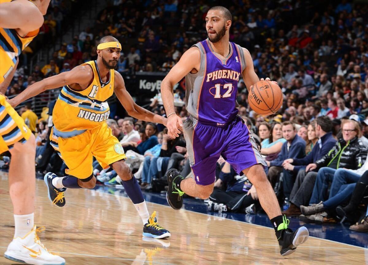Point guard Kendall Marshall (12), who played for the Phoenix Suns last season before being traded to Washington and then waived, has been signed by the Lakers.