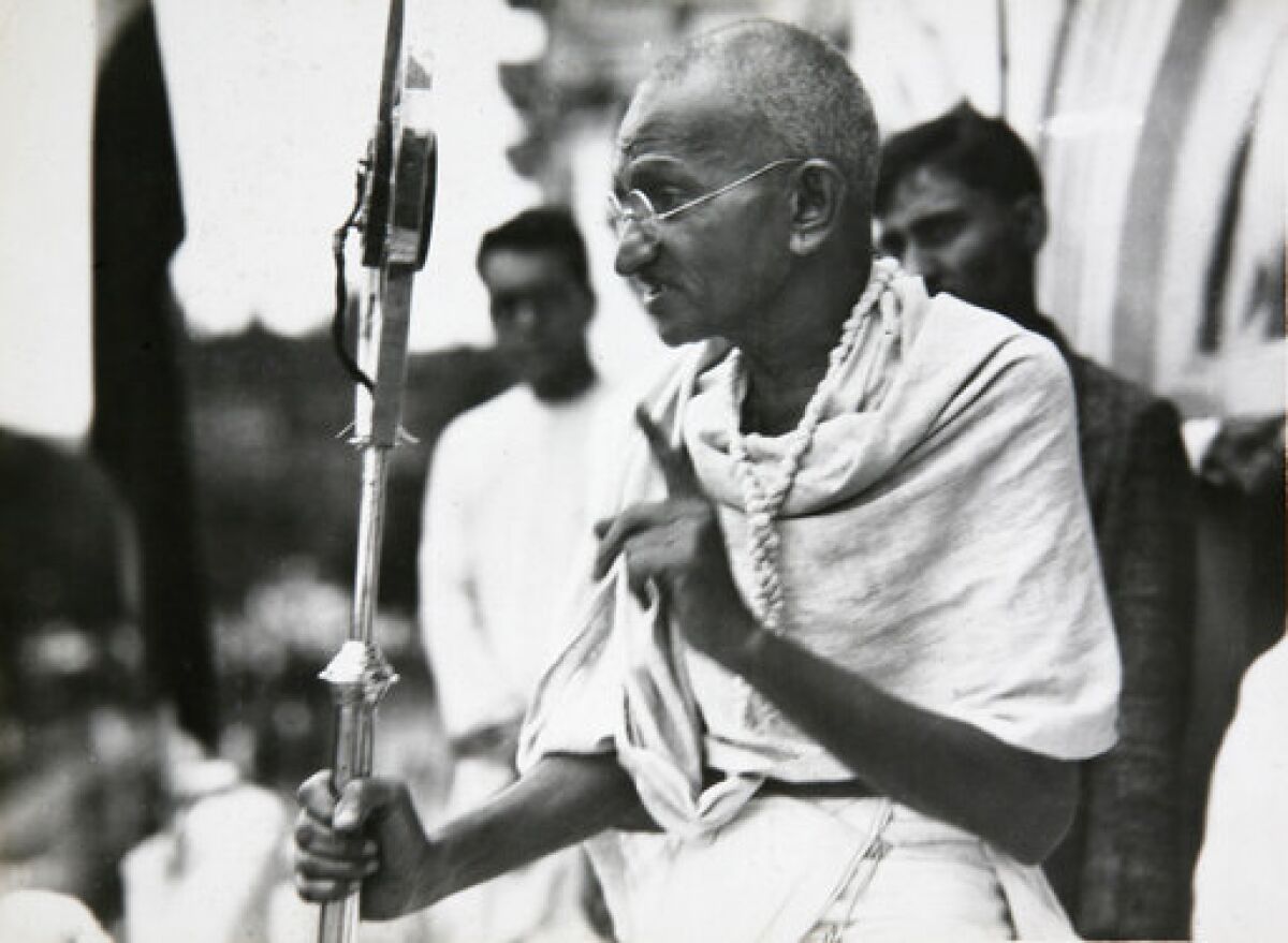 FILE - In this file photo dated 1931, Mahatma Gandhi talks to a crowd in India. Israel’s national library has unearthed an 80-year-old handwritten letter that Gandhi sent a Jewish official upon the outbreak of World War II. The father of modern India wrote the Jewish New Year greeting to the head of a local Jewish organization on Sept. 1, 1939 wishing him “an era of peace for your afflicted people.” (AP Photo/James A. Mills, File)