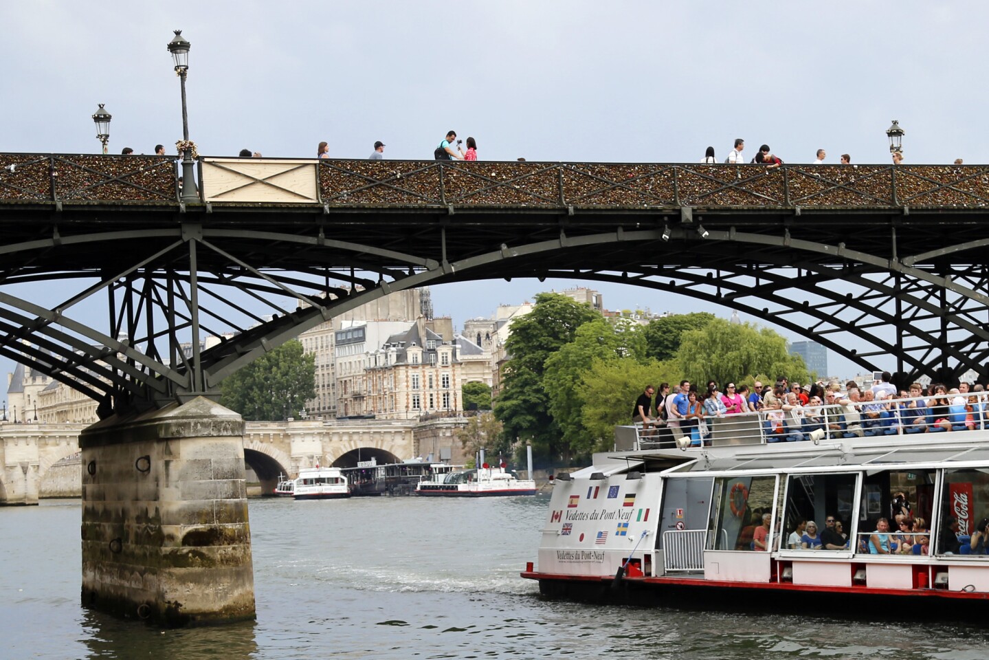 Part of the Pont des Arts collapsed Sunday because of the weight of the locks, according to media reports. The wooden panel was put up temporarily.