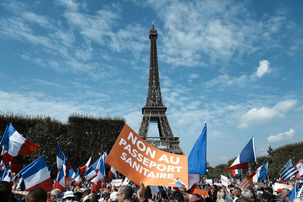 A protest against a COVID-19 health pass in front of the Eiffel Tower