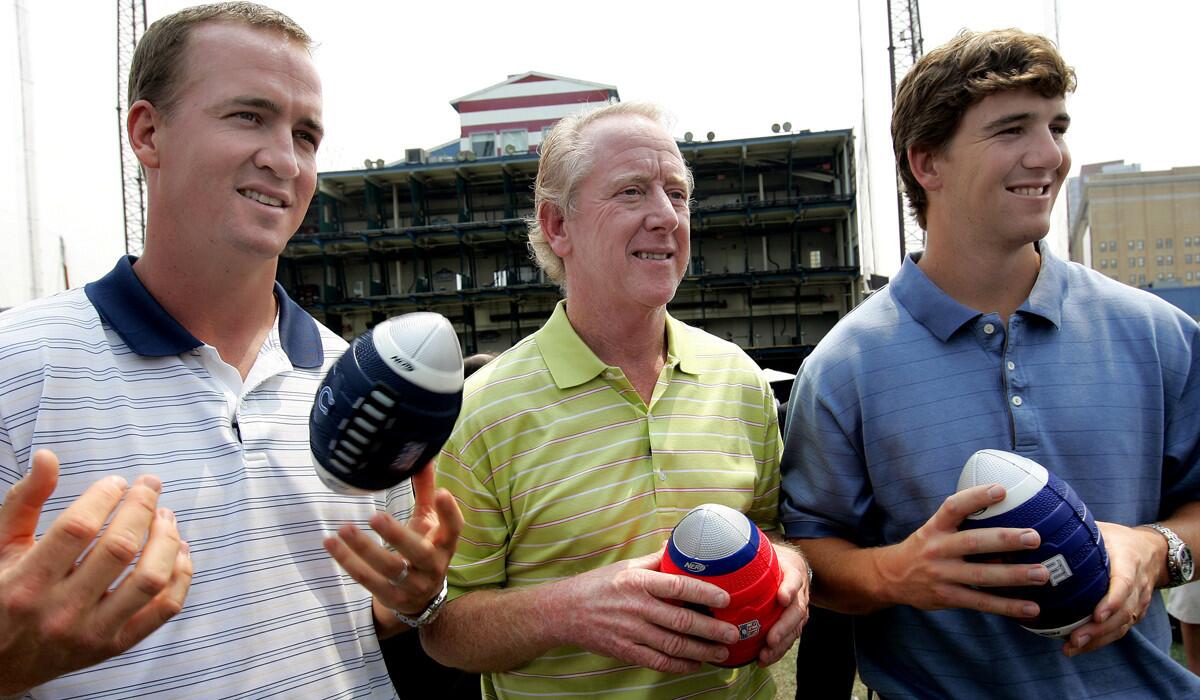 Archie Manning, center, is flanked by sons Peyton, left, and Eli, during a Nerf Father's Day promo on June 14, 2008.