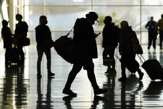 FILE - Passengers walk through Salt Lake City International Airport in Salt Lake City, Oct. 27, 2020. More than a year and a half after COVID-19 concerns prompted the U.S. to close its borders to international travelers from countries including Brazil, China, India, South Africa, the United Kingdom and much of Europe, restrictions are shifting to focus on vaccine status. Beginning Monday, bans on travel from specific countries are over. The U.S. will allow in international travelers, but they must be vaccinated — with a few exceptions. (AP Photo/Rick Bowmer, File)