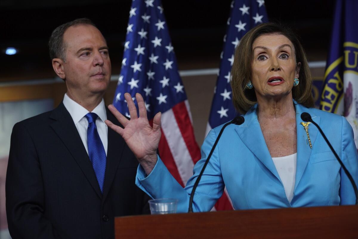 Adam Schiff and Nancy Pelosi at a press conference