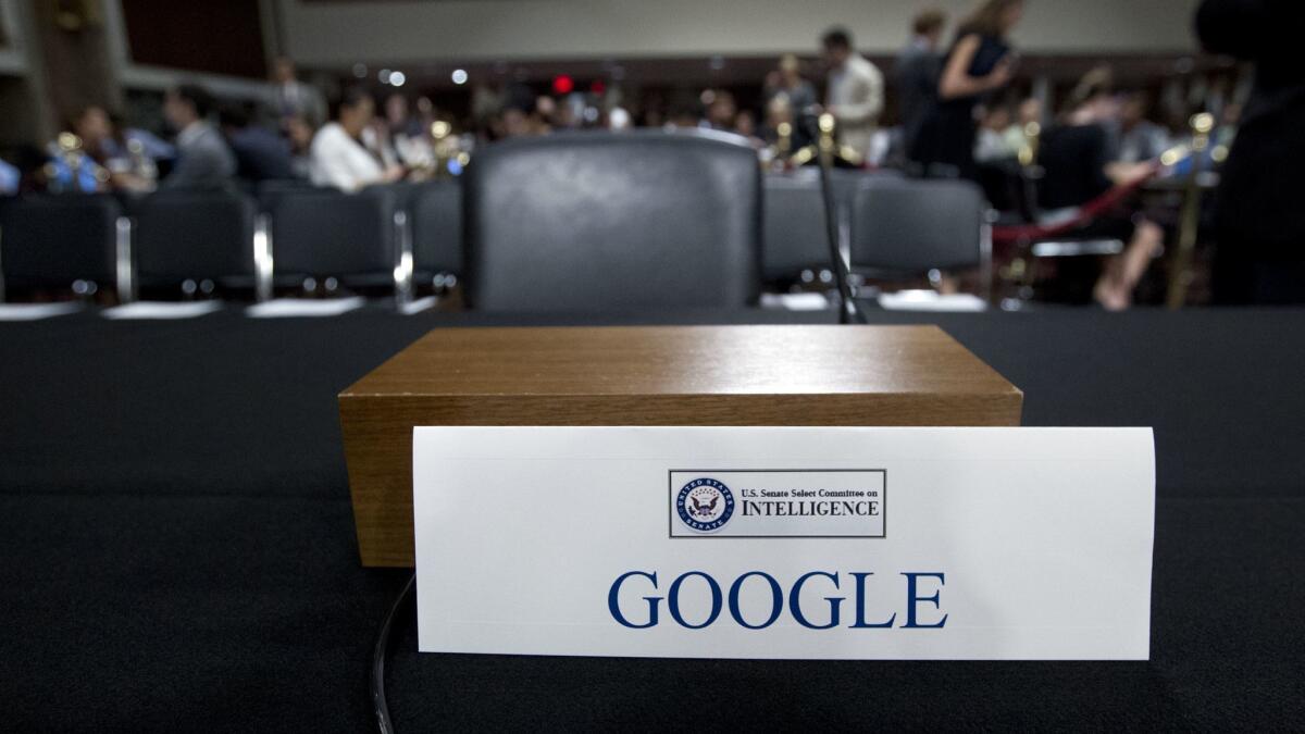 An empty chair reserved for Google's parent Alphabet, which refused to send its top executive, is seen at a Sept. 5 Senate Intelligence Committee hearing on Capitol Hill in Washington.