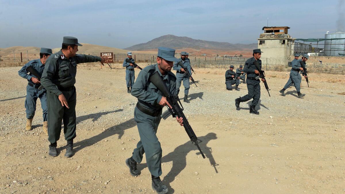 Afghan policemen display their skills at a training center on the outskirts of Jalalabad in Nangarhar province.