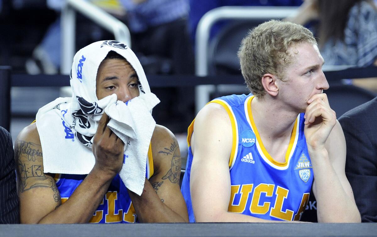 While Norman Powell, left, has played his final game for UCLA, center Thomas Welsh and the Bruins will return plenty of experience and depth next season.