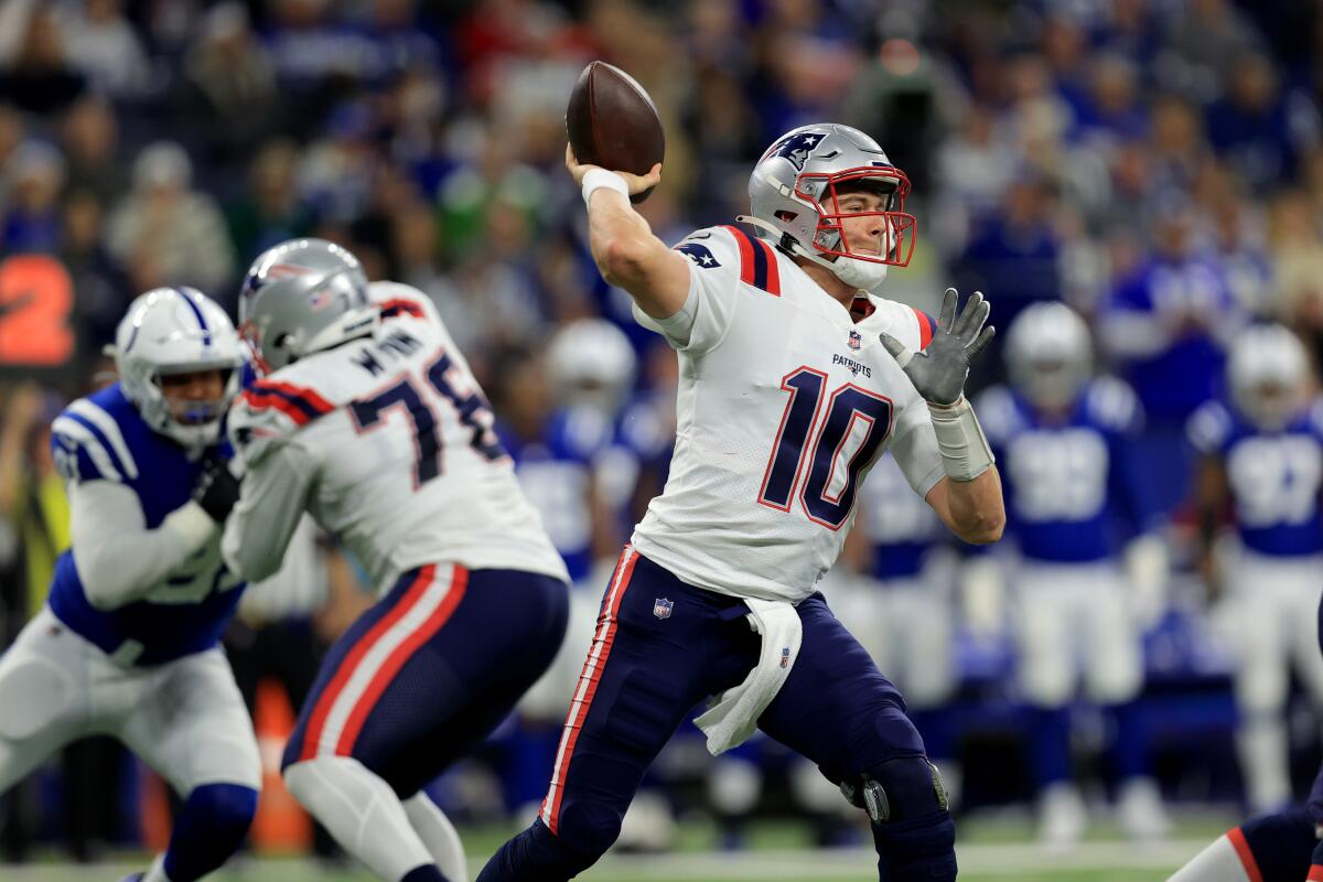 New England Patriots quarterback Mac Jones throws against the Indianapolis Colts on Saturday.