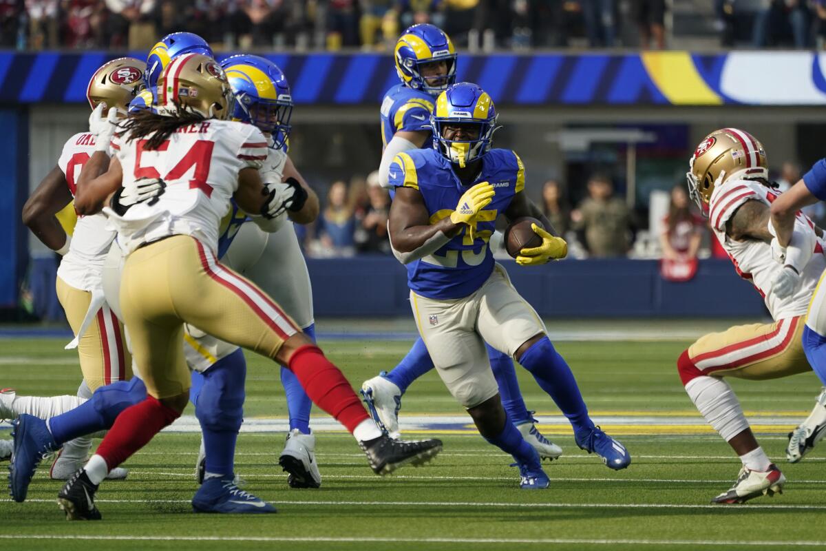 Rams running back Sony Michel carries the ball during the first quarter.