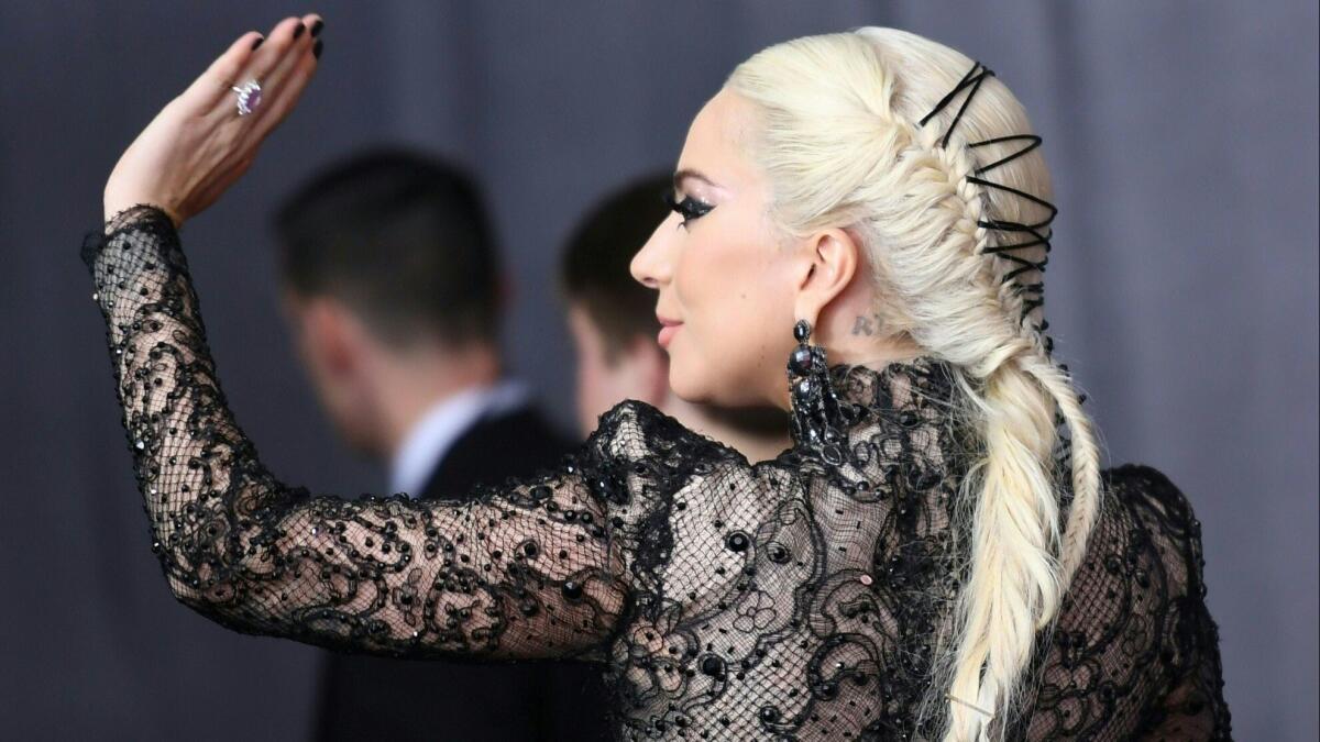 There wasn't a meat dress in sight, but Lady Gaga still grabbed attention for wearing Armani Privé with a Victorian-inspired hairdo by longtime hairstylist Frederic Aspiras for the 60th Grammy Awards on Sunday in New York.