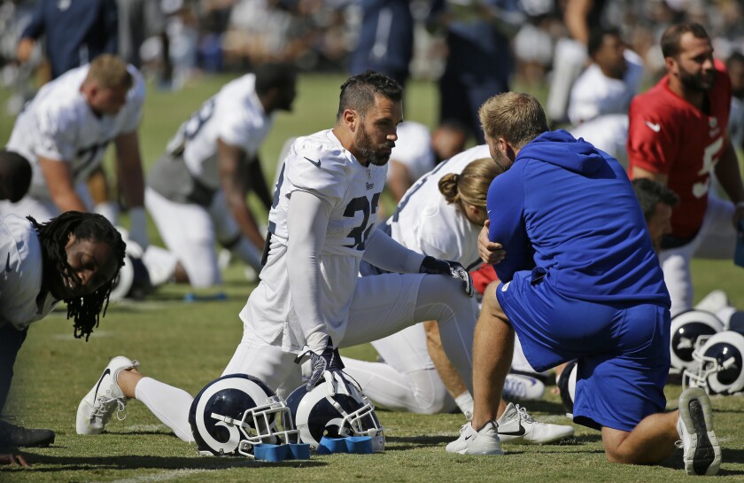 Rams coach Sean McVay, right, talks with free safety Eric Weddle during a practice session on Aug. 8.